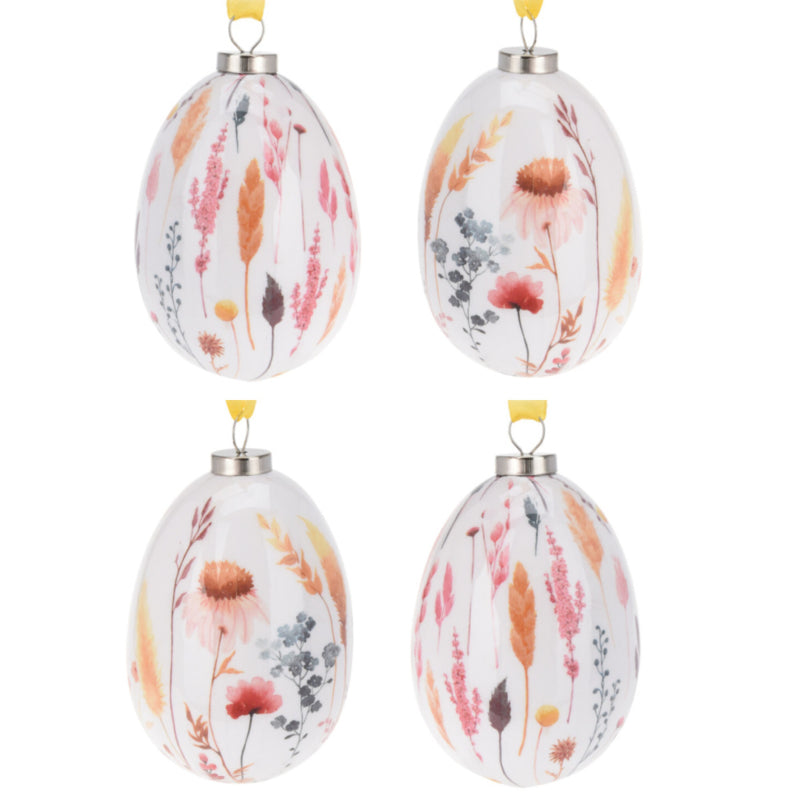 Paasdecoratie set van 4 paaseieren met grassen en bloemen in roze-, rood- en oranjetinten 10 cm hoog
