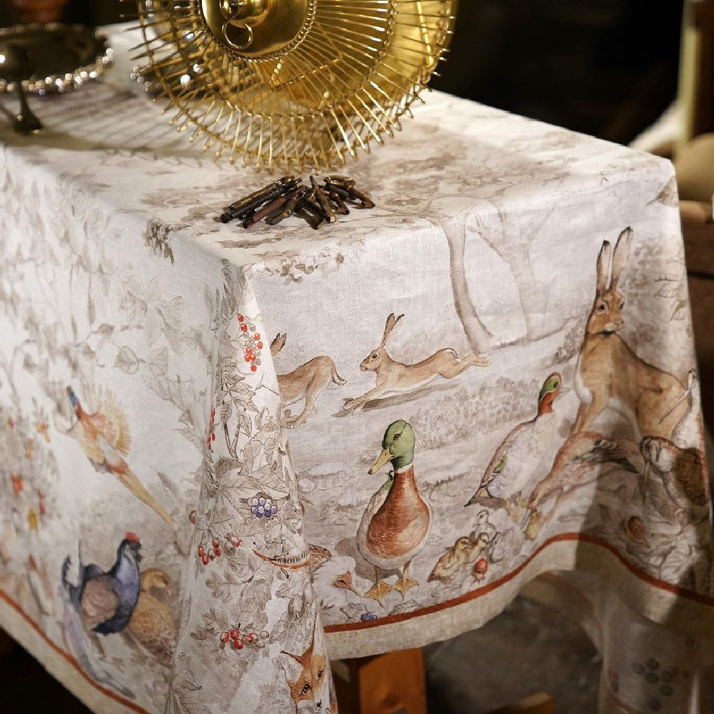 Tessitura Norma Linnen tafelloper en tafelkleden met reeën, korhoenders, hazen etc
