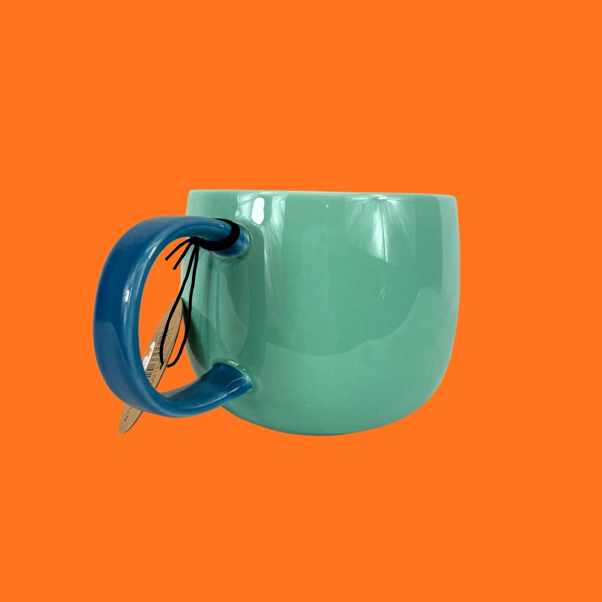 ASA Joy mug blueberry smoothie, green with blue handle