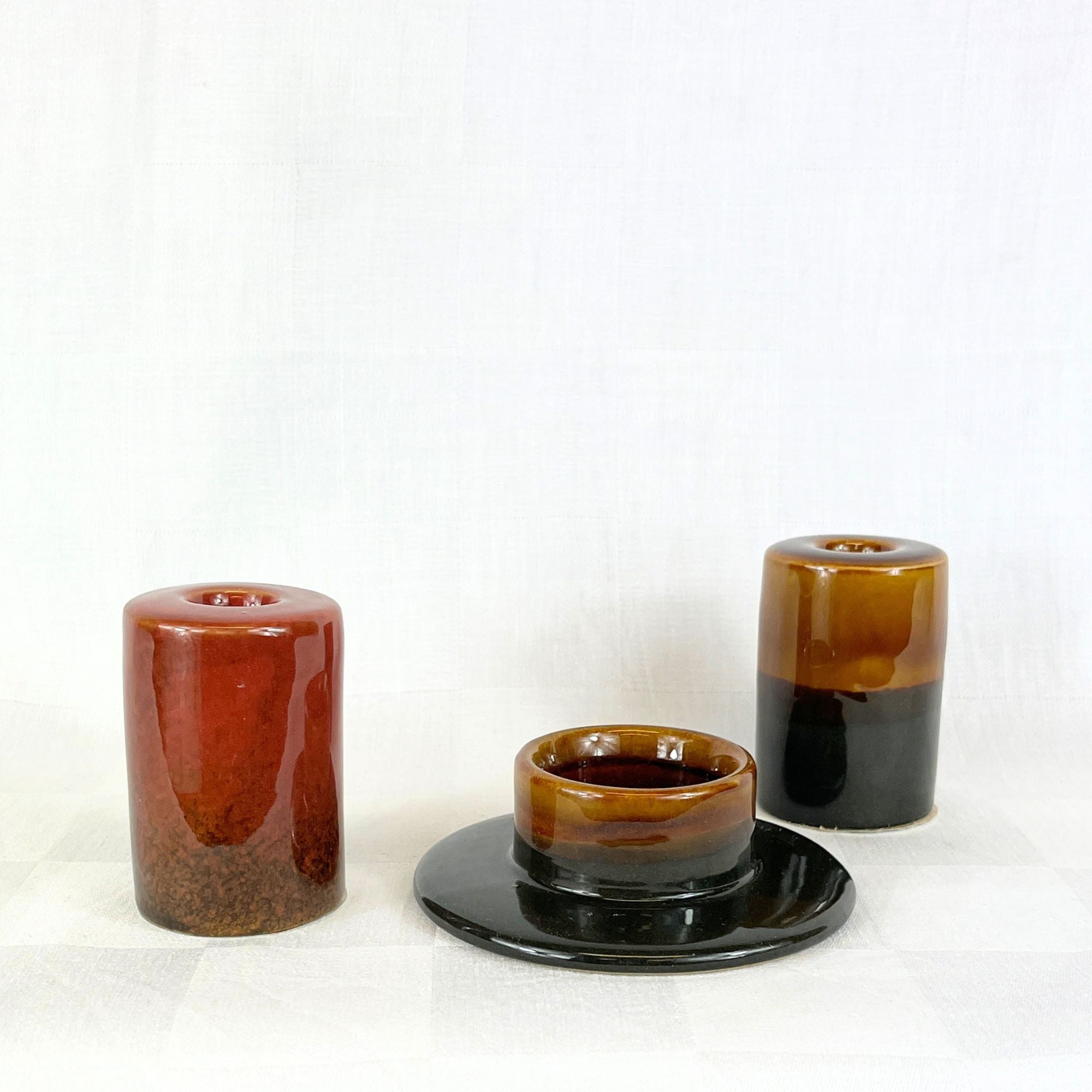 Waxinelichthouder zwart- en bruintinten reactief glazuur